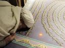 باكستاني يكتب أكبر مصحف في العالم ( صـور )#بلغت تكلفته نصف مليون دولار